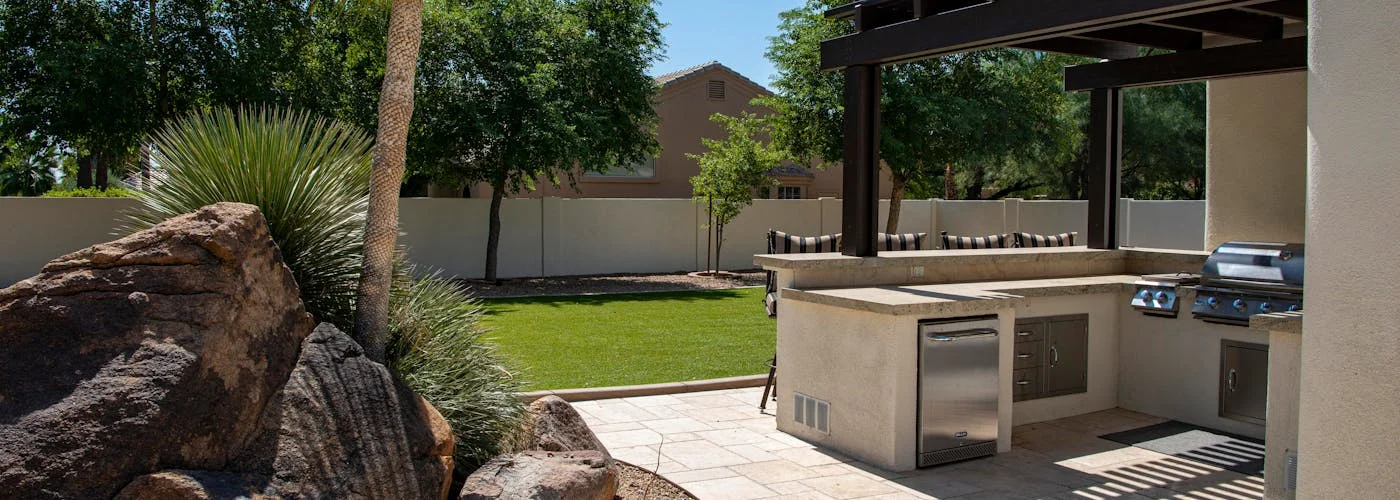 Outdoor kitchen with built-in grill and countertops in Brownsburg, IN by Terry Brodnik Group